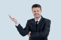 Smiling businessman pointing copy space. Royalty Free Stock Photo