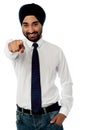 Smiling businessman pointing towards you Royalty Free Stock Photo