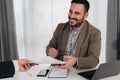 Smiling businessman preparing signing contract with client Royalty Free Stock Photo