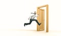 Smiling businessman runs and enters a gold door