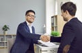 Smiling businessman shaking client hand, closing successful deal Royalty Free Stock Photo