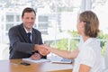 Smiling businessman shaking hand of a job applicant Royalty Free Stock Photo