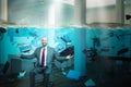 Smiling businessman sitting in an office completely flooded