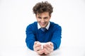 Smiling businessman sitting at the table