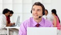 Smiling businessman talking on headset Royalty Free Stock Photo