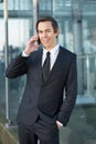 Smiling businessman talking on mobile phone outdoors Royalty Free Stock Photo