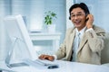 Smiling businessman using headset Royalty Free Stock Photo