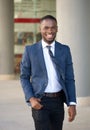 Smiling businessman walking in the city Royalty Free Stock Photo