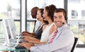 Smiling businessman working in a call center Royalty Free Stock Photo