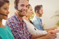 Smiling businessman working in a call centre Royalty Free Stock Photo
