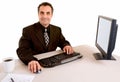 Smiling Businessman Working at his Desk