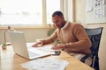 Smiling Businessman Working Office. Positive Guy Examining Documents