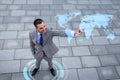 Smiling businessman with world map projection Royalty Free Stock Photo