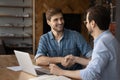 Smiling businessmen handshake closing deal at meeting Royalty Free Stock Photo