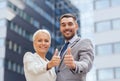 Smiling businessmen showing thumbs up Royalty Free Stock Photo