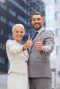 Smiling businessmen showing thumbs up Royalty Free Stock Photo