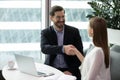 Smiling businesspeople handshake closing deal at briefing Royalty Free Stock Photo