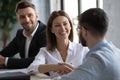 Smiling businesspeople handshake get acquainted at office briefing Royalty Free Stock Photo