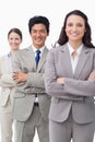 Smiling businessteam standing with folded arms