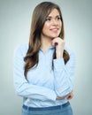 Smiling businesswoman blue shirt dressed standing on gray background. Royalty Free Stock Photo