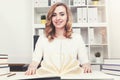 Smiling businesswoman with a book Royalty Free Stock Photo