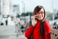 Smiling businesswoman calling by phone