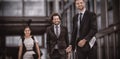 Smiling businesswoman with colleagues walking Royalty Free Stock Photo