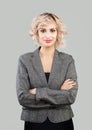 Smiling businesswoman with crossed arms portrait. Smart woman in suit portrait