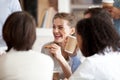 Smiling businesswoman eating pizza with colleagues on break Royalty Free Stock Photo