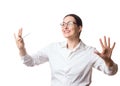 Smiling businesswoman in formal shirt and glasses does expressive gesture with a pen in hand. Manager, boss, agent or