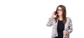 Smiling businesswoman in glasses talking on mobile phone. Beautiful young girl in Blazer on white isolated background Royalty Free Stock Photo