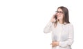 Smiling businesswoman in glasses talking on mobile phone. Beautiful young girl in white shirt on white isolated background talking Royalty Free Stock Photo