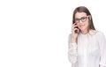 Smiling businesswoman in glasses talking on mobile phone. Beautiful young girl in white shirt on white isolated background talking Royalty Free Stock Photo