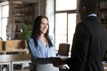 Smiling businesswoman handshaking with executive, getting job or reward Royalty Free Stock Photo