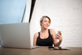 Smiling businesswoman having on-line video call on cell telephone Royalty Free Stock Photo