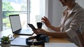 Smiling businesswoman having video call via smart phone in the office. Royalty Free Stock Photo