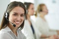 Smiling businesswoman or helpline operator with headset and computer at office Royalty Free Stock Photo