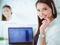 Smiling businesswoman or helpline operator with headset and computer at office Royalty Free Stock Photo