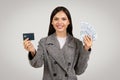 Smiling businesswoman holding cash and credit card Royalty Free Stock Photo