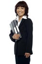 Smiling businesswoman holding her file folder Royalty Free Stock Photo