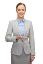 Smiling businesswoman holding something imaginary