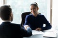 Smiling businesswoman hr manager shaking successful candidate hand