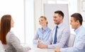 Smiling businesswoman at interview in office Royalty Free Stock Photo