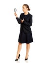 Smiling businesswoman with magnifying glass Royalty Free Stock Photo