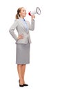 Smiling businesswoman with megaphone