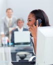 Smiling businesswoman on phone at her desk Royalty Free Stock Photo