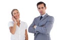 Smiling businesswoman on the phone next to her colleague Royalty Free Stock Photo