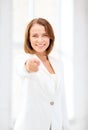 Smiling businesswoman pointing finger at you Royalty Free Stock Photo