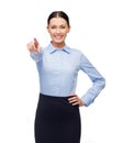 Smiling businesswoman pointing finger at you Royalty Free Stock Photo