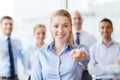 Smiling businesswoman pointing finger on you Royalty Free Stock Photo
